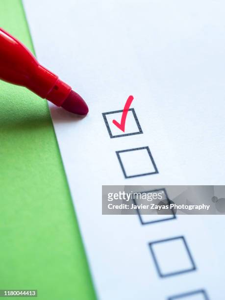check mark in checklist box on white and green background - check box bildbanksfoton och bilder