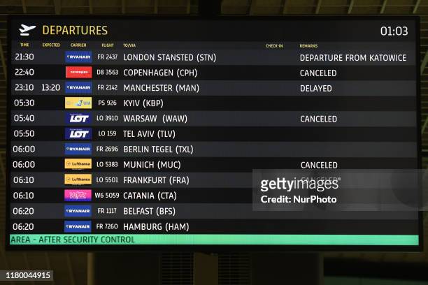 General view of the Departure Screen with cancelled, delayed and diverted flights from Krakow airport on 23rd October 2019. Fog at Krakow Airport...