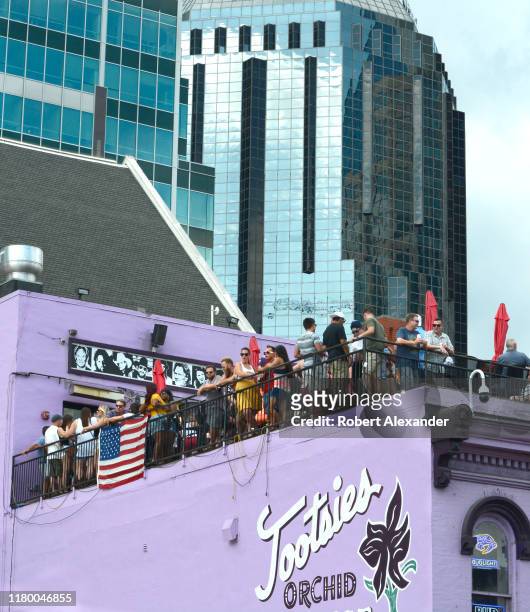 Customer crowd the rooftop bar at Tootsie's Orchid Lounge, an iconic bar and live country music venue in the Lower Broadway entertainment district in...