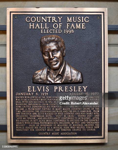 An bronze plaque honoring Elvis Presley as a member of the Country Music Hall of Fame on display at the Country Music Hall of Fame and Museum in...