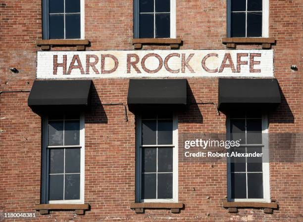 Sign painted on the facade of a 19th century brick warehouse along the Cumberland River in downtown Nashville, Tennessee, advertises the Hard Rock...