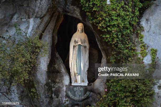 Picture shows the statue of the Virgin Mary, inside the Massabielle cave where the Virgin Mary is said to have appeared to Bernadette Soubirous, in...