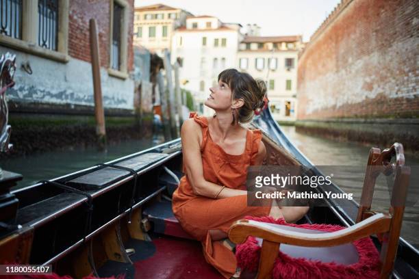 woman in a gondola - journey stock-fotos und bilder