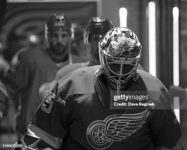 Goaltender Jimmy Howard of the Detroit Red Wings leads teammates towards the ice prior to an NHL game against the Anaheim Ducks at Little Caesars...