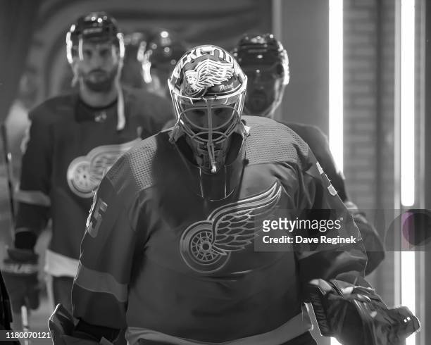 Goaltender Jimmy Howard of the Detroit Red Wings leads teammates towards the ice prior to an NHL game against the Anaheim Ducks at Little Caesars...