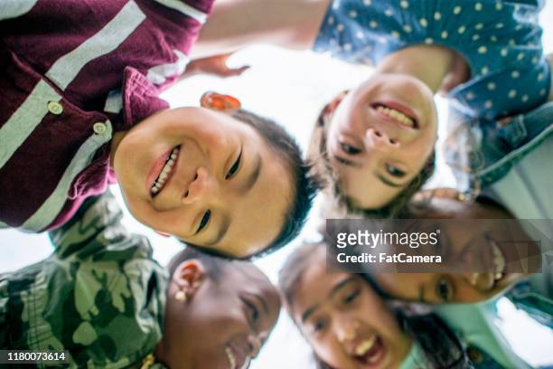 multi-ethnic group of children outside stock photo - development camp stock pictures, royalty-free photos & images