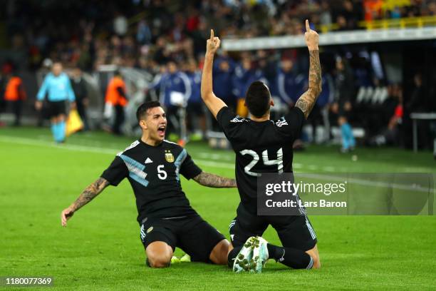 Lucas Ocampos of Argentina celebrates with teamate Leandro Parades after scoring his team's second goal during the International Friendly match...