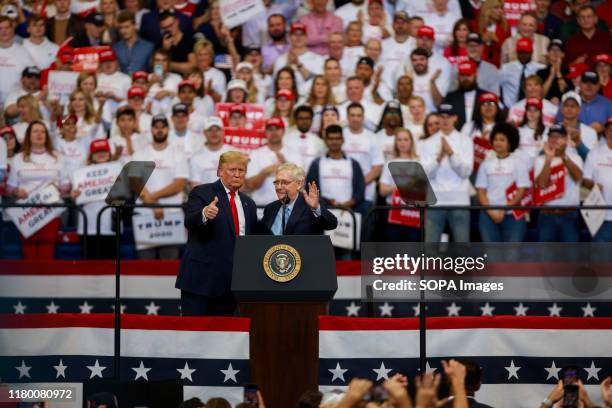 United States President Donald J. Trump and Senate Majority Leader Mitch McConnell make gestures during a Keep America Great rally at the Rupp Arena...