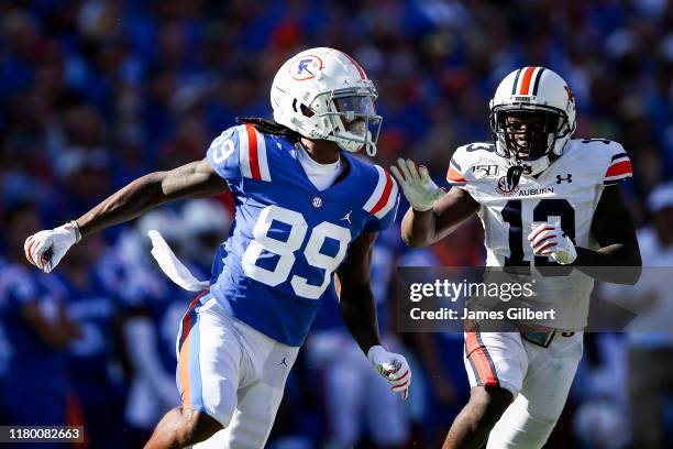 Tyrie Cleveland of the Florida Gators in action against Javaris Davis of the Auburn Tigers during a punt return in the third quarter of a game at Ben...