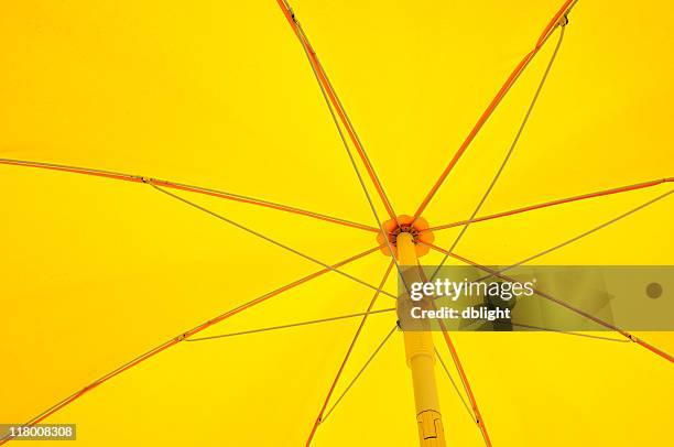 inside of opened yellow umbrella - yellow umbrella stock pictures, royalty-free photos & images