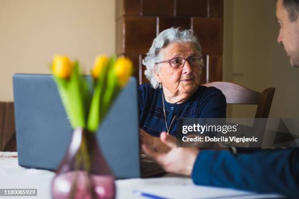 mature woman talking to lawyer - true crime stock pictures, royalty-free photos & images