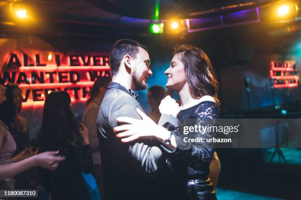 romantic couple dancing to the music - slow dancing stock pictures, royalty-free photos & images