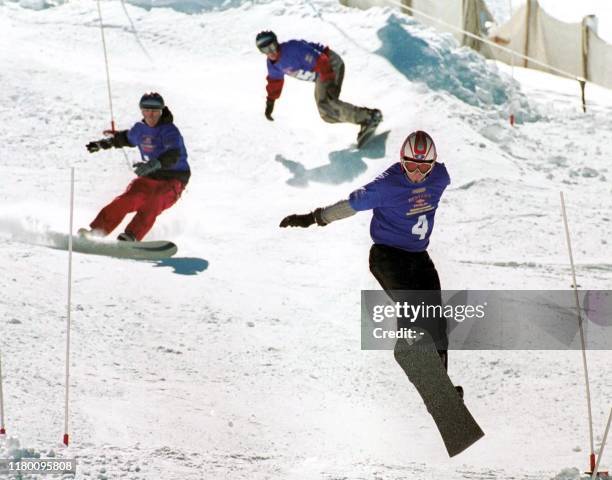 Clive Hildering from South Africa takes a flying leap to victory in the men's Boarder Cross event at the Hunter s Snow Festival 28 July 2001 in...