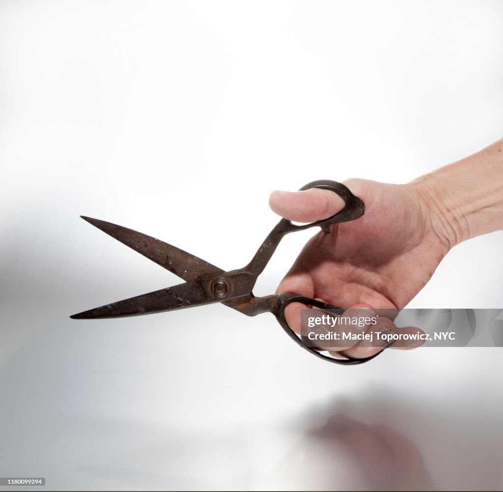 Using Rusty Scissors Hand With An Old And Rusty Scissors High-Res Stock Photo - Getty Images