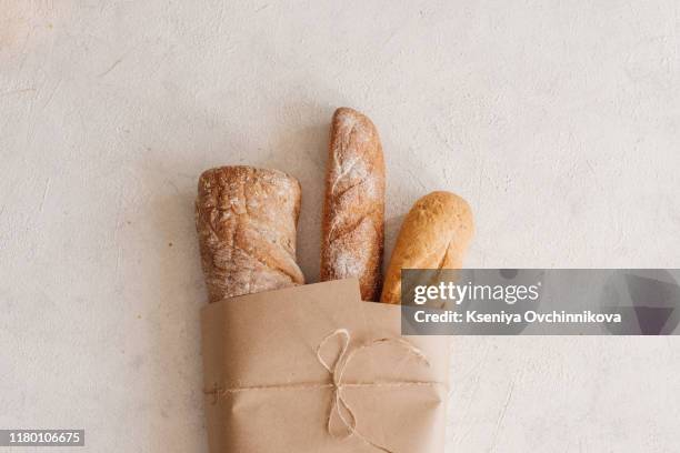 fresh bread on wooden table. top view with space for your text - baguette stock pictures, royalty-free photos & images