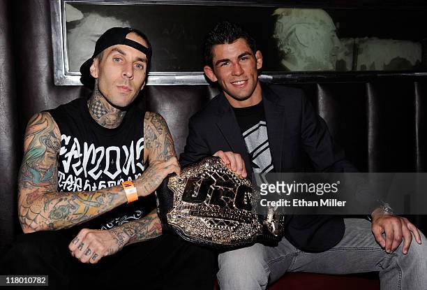 Drummer Travis Barker and mixed martial artist Dominick Cruz attend a post-fight party for UFC 132 at Studio 54 inside the MGM Grand Hotel/Casino...