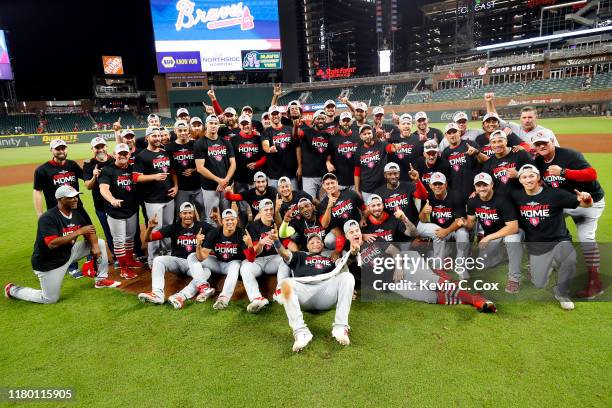 The St. Louis Cardinals pose for a team photo as they celebrate their 13-1 win over the Atlanta Braves in game five of the National League Division...