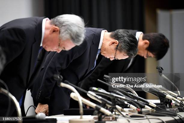 Kansai Electric Power Co., Chairman Makoto Yagi and President Shigeki Iwane bow in apology at a news conference on October 9, 2019 in Osaka, Japan....