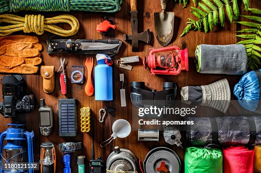 Top view camping and hiking travel and hiking gear, equipment and accessories for mountain trips Top view camping and hiking travel and hiking gear, equipment and accessories for mountain trips