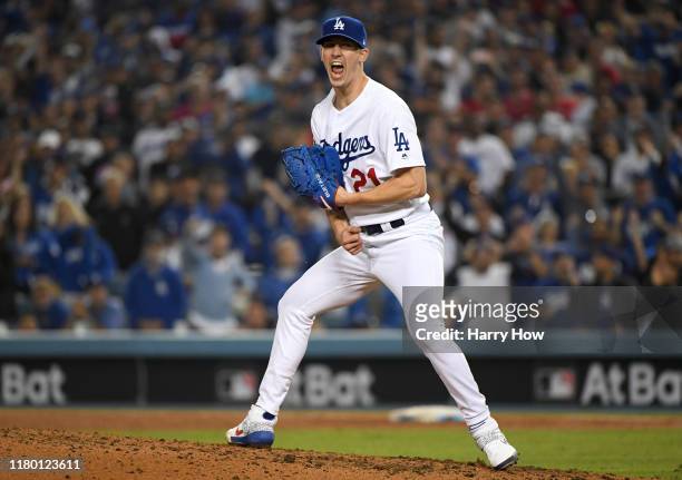 Walker Buehler of the Los Angeles Dodgers celebrates after striking out Ryan Zimmerman of the Washington Nationals for the third out of the sixth...