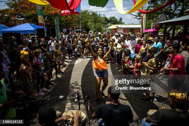 An attendee dances during the Saint James the Apostle festival celebrations in Loiza, Puerto Rico, on Saturday, July 2019. Former Governor Ricardo...