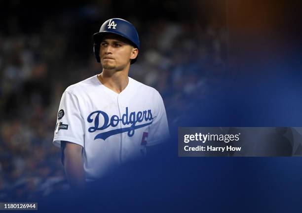 Corey Seager of the Los Angeles Dodgers reacts after striking out in the sixth inning of game five of the National League Division Series against the...