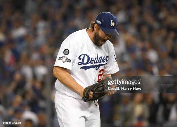 Clayton Kershaw of the Los Angeles Dodgers reacts to the third out of the seventh inning of game five of the National League Division Series against...