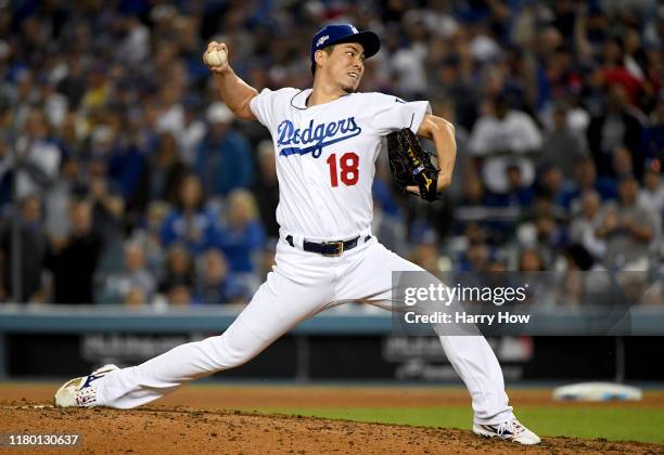 Kenta Maeda of the Los Angeles Dodgers pitches in the eighth inning of game five of the National League Division Series against the Washington...