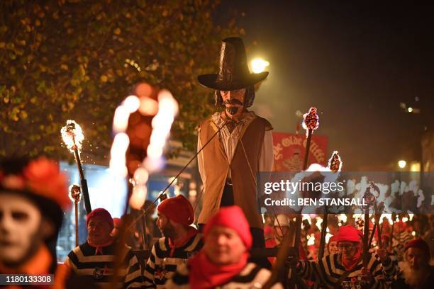 An effigy of Guy Fawkes is paraded through the streets of Lewes in East Sussex, southern England, on November 5 during the traditional Bonfire Night...