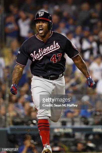 Howie Kendrick of the Washington Nationals celebrates after hitting a grand slam in the tenth inning of game five of the National League Division...