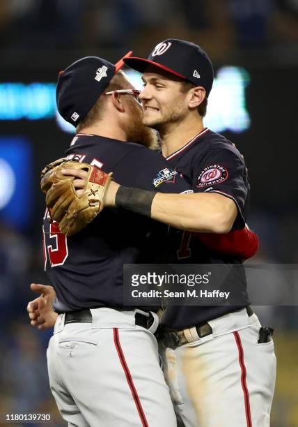 Trea Turner of the Washington Nationals celebrates with Sean Doolittle after the Nationals defeated the Los Angeles Dodgers 7-3 in game five to win...