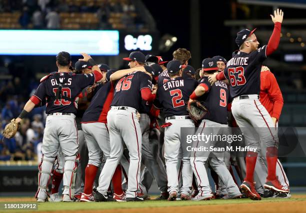 Sean Doolittle of the Washington Nationals celebrates with his team as the Nationals defeated the Los Angeles Dodgers 7-3 in game five to win the...