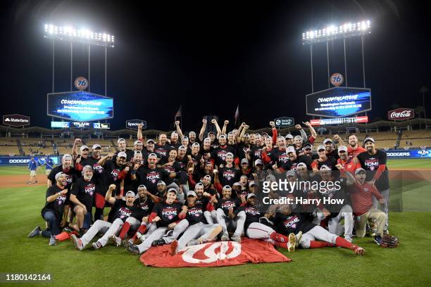 The Washington Nationals celebrate defeating the Los Angeles Dodgers 7-3 in ten innings in game five to win the National League Division Series at...