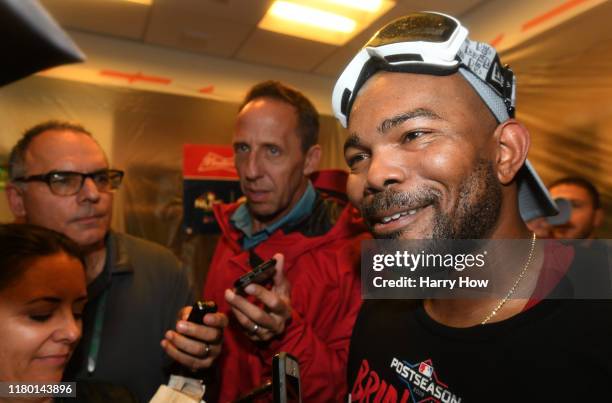 Howie Kendrick of the Washington Nationals is interviewed after his team defeated the Los Angeles Dodgers 7-3 in ten innings to win game five and the...