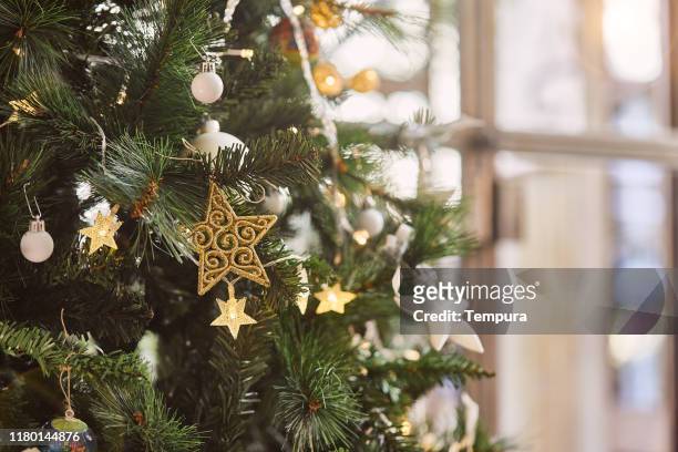 detail of christmas tree with copy space. - christmas tree home stock pictures, royalty-free photos & images