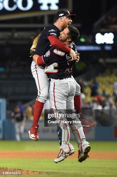 Sean Doolittle and catcher Yan Gomes of the Washington Nationals celebrate the final out of the tenth inning as the Nationals defeated the Los...