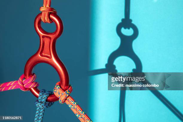 connection and safety concepts, ropes and carabiners - カラビナ ストックフォトと画像