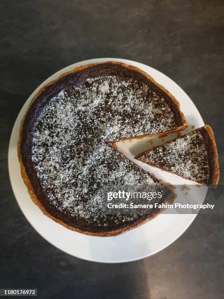 high angle view of chocolate and coconut tart - grated pie stock pictures, royalty-free photos & images