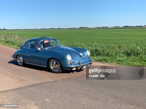 porsche 356 classic german sports car driving on a country road - old car side view stock pictures, royalty-free photos & images