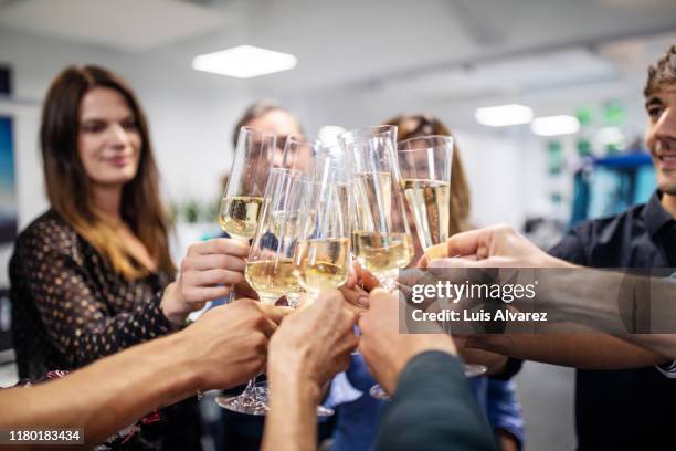 business people toasting champagne flutes in office - personal perspective office stock pictures, royalty-free photos & images