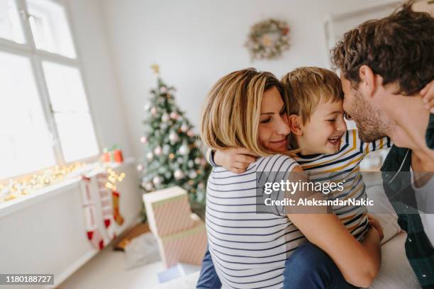 christmas morning in our home - hug christmas stock pictures, royalty-free photos & images