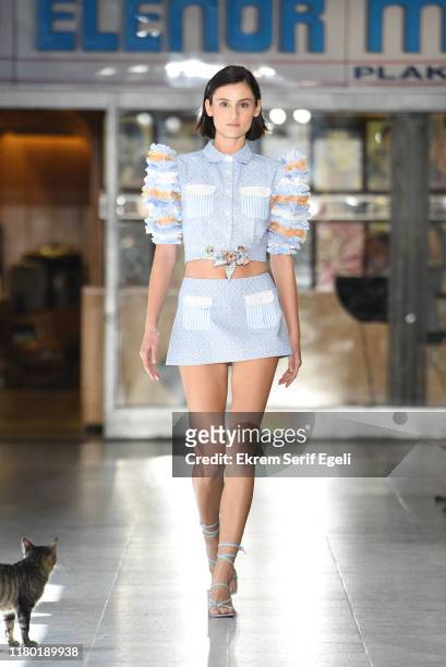 Model walks the runway during the Sudi Etuz show during Mercedes-Benz Istanbul Fashion Week at on October 10, 2019 in Istanbul, Turkey.