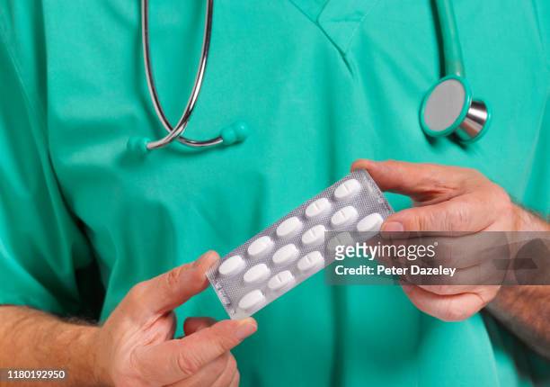doctor offering anti depressants to patient - opiates stock pictures, royalty-free photos & images