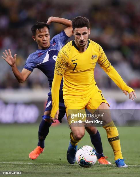 Mathew Leckie of the Socceroos is challenged by Bishal Rai of Nepal during the FIFA World Cup Qatar 2022 and AFC Asian Cup China 2023 Preliminary...