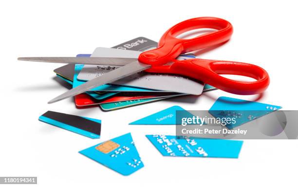in debt, cut up credit card - credit card debt stock pictures, royalty-free photos & images