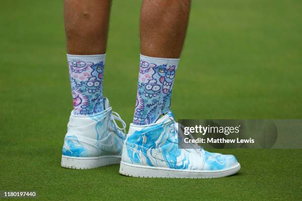 The shoes and socks of John 'Long Socks' McLaren, caddie of Paul Casey of England is seen during Day One of the Italian Open at Olgiata Golf Club on...