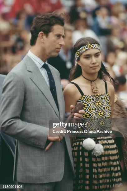 Prince Charles, Prince of Wales, with a Maori in traditional dress, at the Eden Park Stadium on his arrival in Auckland at the start of the Royal...
