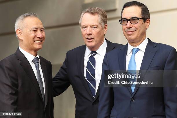 Chinese Vice Premier Liu He is greeted by U.S. Trade Representative Robert Lighthizer and Treasury Secretary Steven Mnuchin as they begin another...