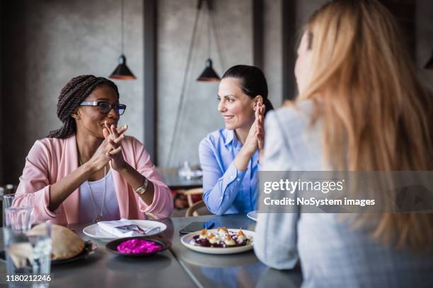 female businesswoman on a meeting in a restaurant - business lunch stock pictures, royalty-free photos & images