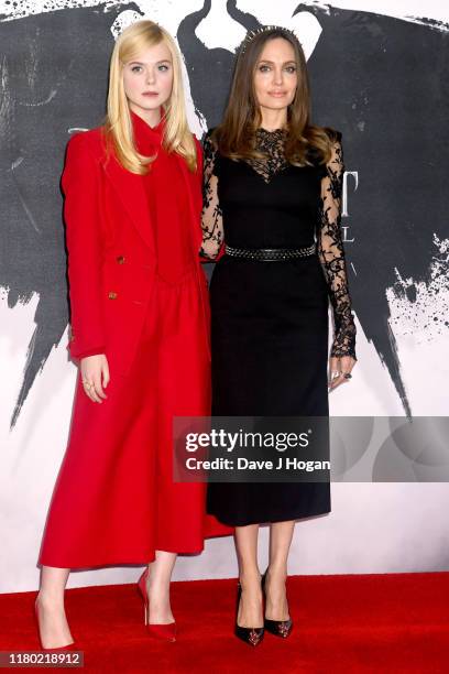 Elle Fanning and Angelina Jolie attend a photocall for "Maleficent: Mistress of Evil" at Mandarin Oriental Hotel on October 10, 2019 in London,...